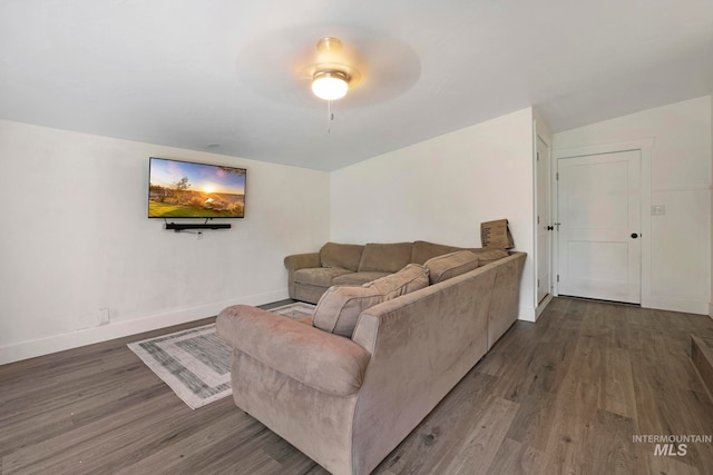 living room with wood-type flooring and ceiling fan