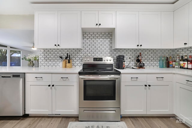 kitchen with white cabinetry and stainless steel appliances