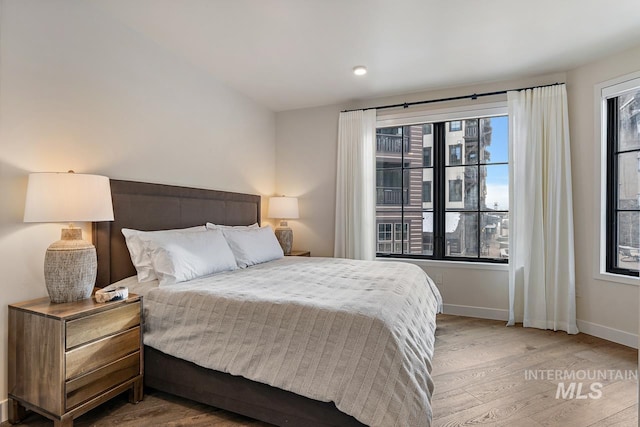 bedroom with hardwood / wood-style flooring