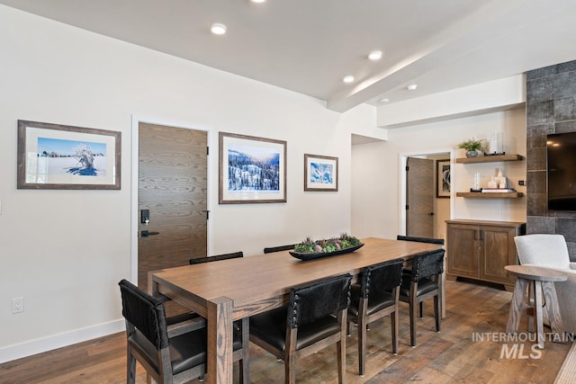 dining area with dark hardwood / wood-style flooring