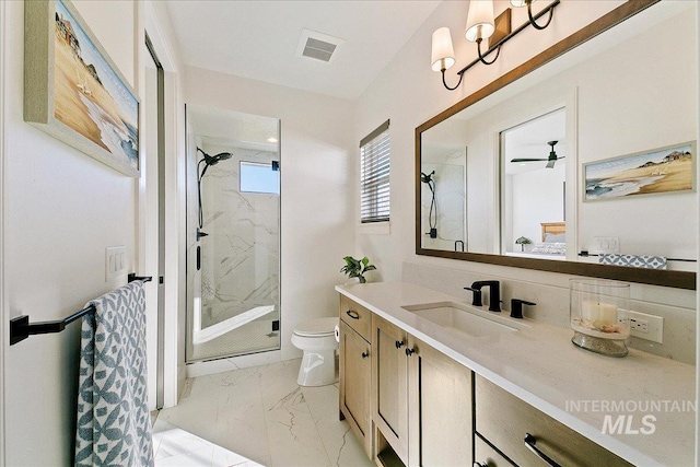 full bathroom with toilet, marble finish floor, a marble finish shower, and vanity