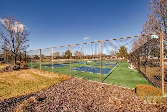 view of tennis court with fence