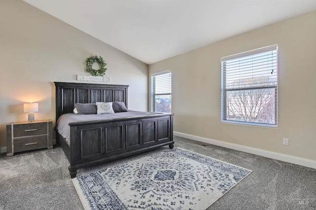 carpeted bedroom with vaulted ceiling