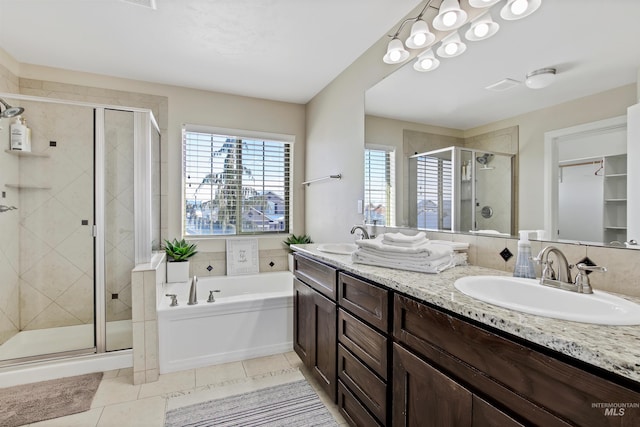 bathroom with vanity, tile patterned floors, and independent shower and bath