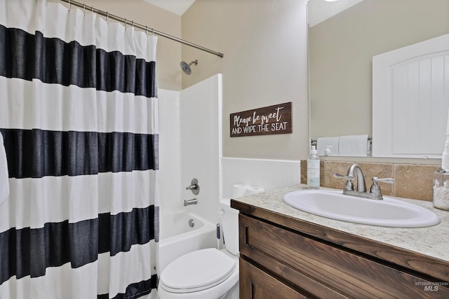 full bathroom with shower / tub combo, vanity, and toilet