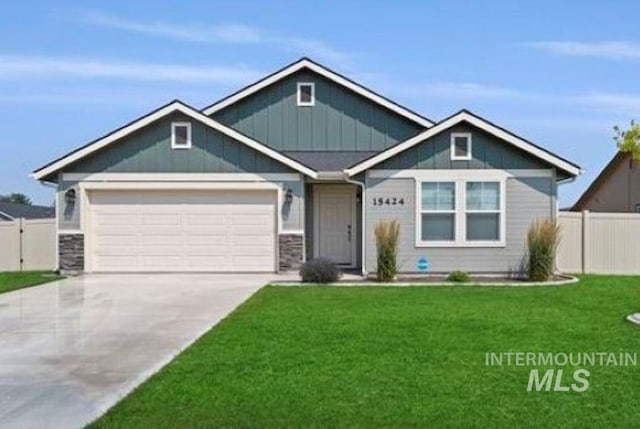 craftsman-style house with driveway, an attached garage, fence, board and batten siding, and a front yard