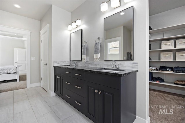 bathroom with tile patterned flooring and vanity