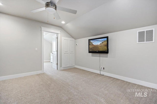 bonus room featuring ceiling fan, light colored carpet, and vaulted ceiling