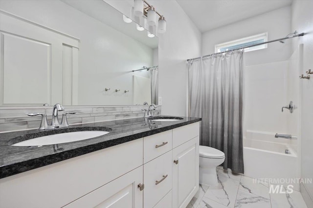 full bathroom with vanity, toilet, and shower / tub combo