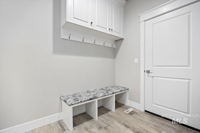 mudroom with light hardwood / wood-style floors