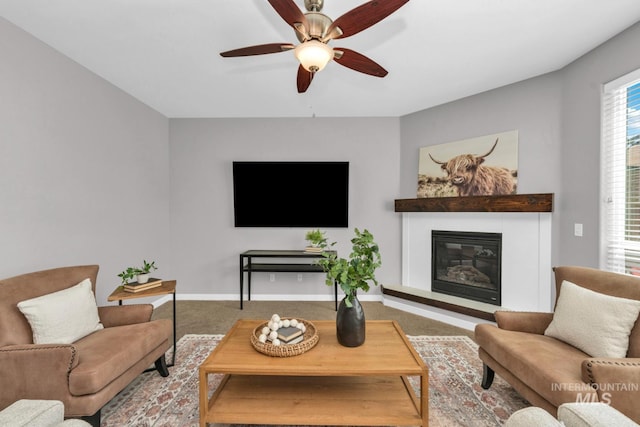 12041 W Ardyce, Boise, ID 83713 - living room with carpet floors, a glass covered fireplace, ceiling fan, and baseboards