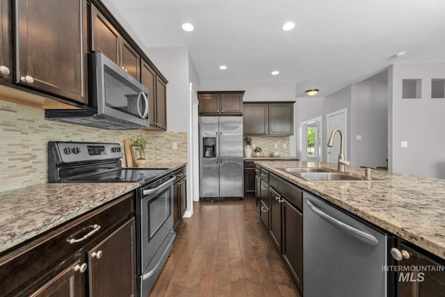 12041 W Ardyce, Boise, ID 83713 - kitchen featuring stainless steel appliances, a sink, dark wood-type flooring, light stone counters, and dark brown cabinets