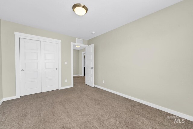 12041 W Ardyce, Boise, ID 83713 - unfurnished bedroom featuring carpet, a closet, and baseboards