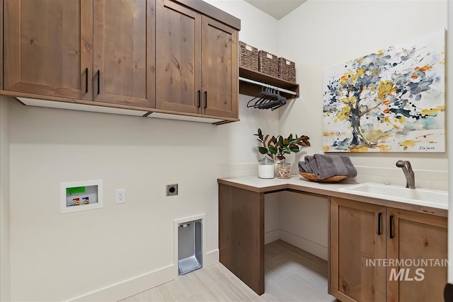 laundry room featuring cabinets, hookup for a washing machine, hookup for an electric dryer, and sink