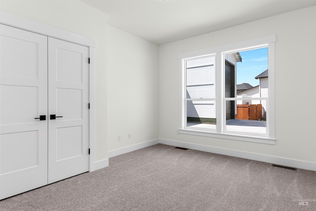 view of carpeted spare room