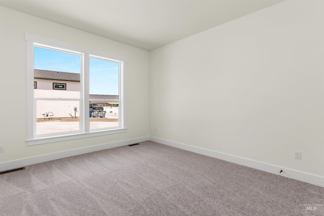 empty room with carpet flooring