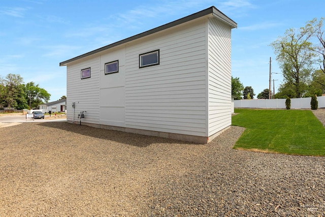 view of side of property featuring a lawn