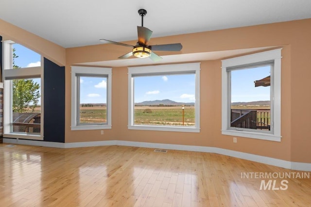 2600 W S Slope Rd, Emmett, ID 83617 - unfurnished room with baseboards, ceiling fan, and light wood-style flooring