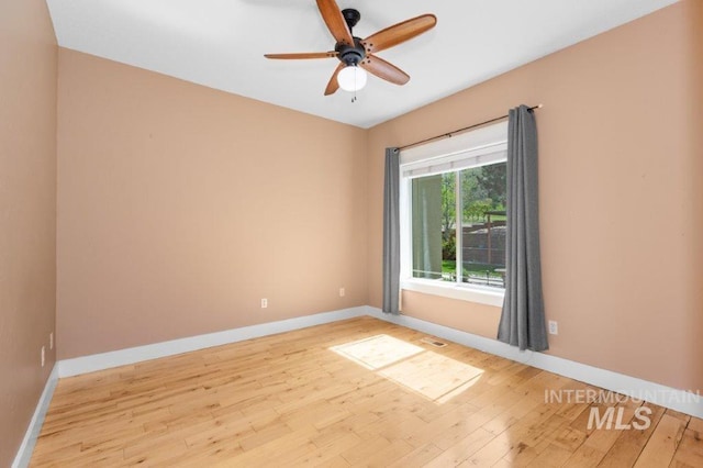 2600 W S Slope Rd, Emmett, ID 83617 - empty room featuring hardwood / wood-style flooring, baseboards, and ceiling fan