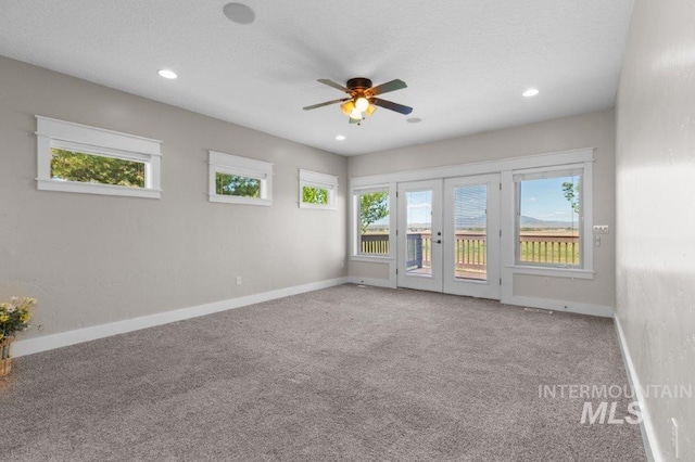 2600 W S Slope Rd, Emmett, ID 83617 - unfurnished room featuring french doors, carpet, baseboards, ceiling fan, and recessed lighting