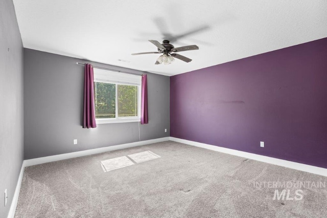 2600 W S Slope Rd, Emmett, ID 83617 - empty room featuring carpet, ceiling fan, and baseboards
