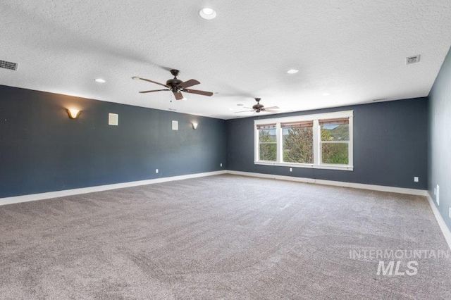2600 W S Slope Rd, Emmett, ID 83617 - unfurnished room featuring a textured ceiling, carpet, baseboards, a ceiling fan, and recessed lighting