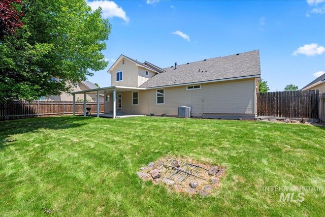 6311 S Solar Way, Boise, ID 83709 - back of property featuring central AC and a patio
