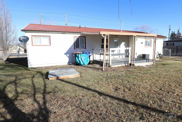 rear view of house with a lawn, cooling unit, and a patio
