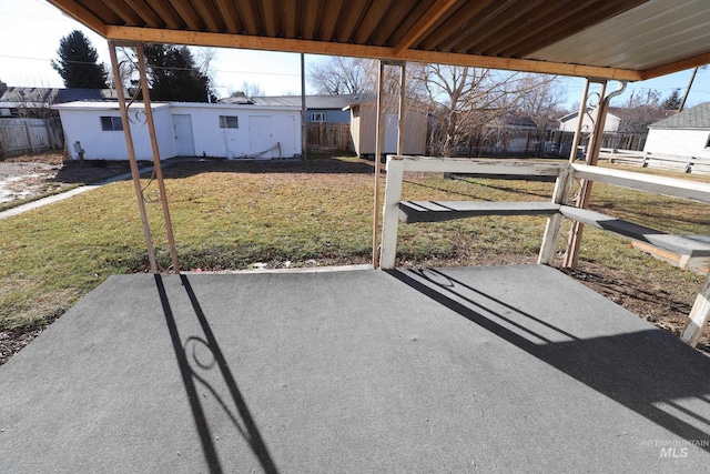 view of patio featuring a shed