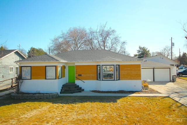 ranch-style house featuring a garage, a front lawn, and roof with shingles