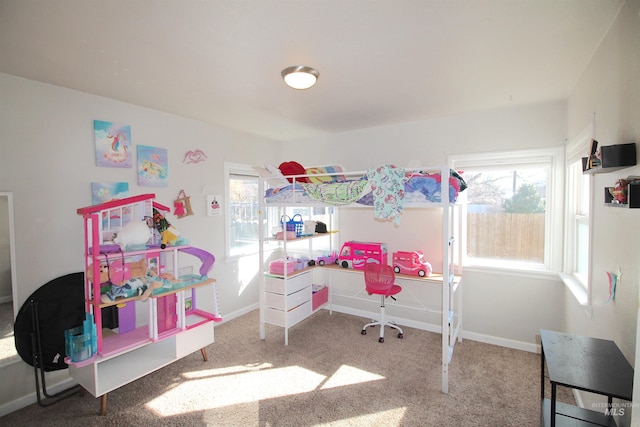 carpeted bedroom with baseboards