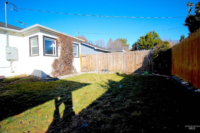 view of yard with a fenced backyard