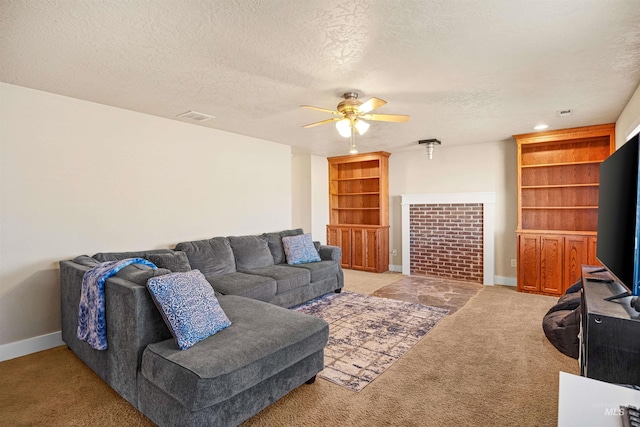 living room featuring built in features, a ceiling fan, visible vents, a textured ceiling, and light colored carpet