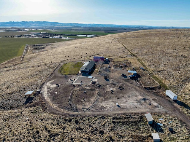 birds eye view of property with a rural view and a mountain view