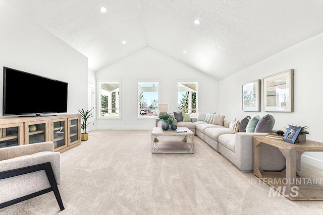 1458 W Sandy Ct, Meridian, ID 83646 - carpeted living area featuring a textured ceiling, plenty of natural light, baseboards, high vaulted ceiling, and recessed lighting