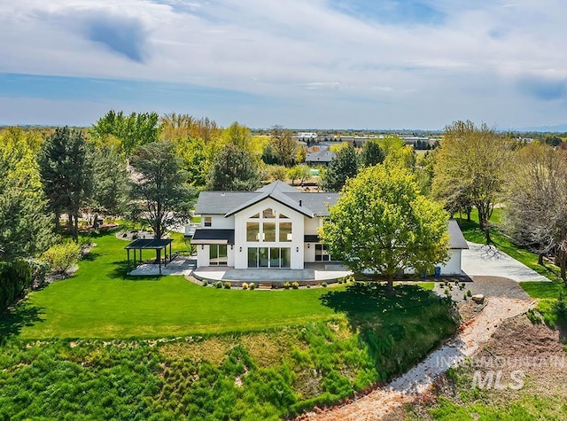1458 W Sandy Ct, Meridian, ID 83646 - rear view of house with a gazebo, stucco siding, a lawn, and a patio area