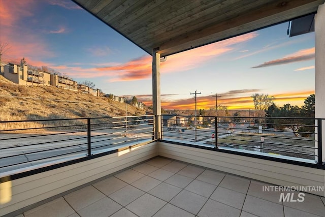 view of balcony at dusk