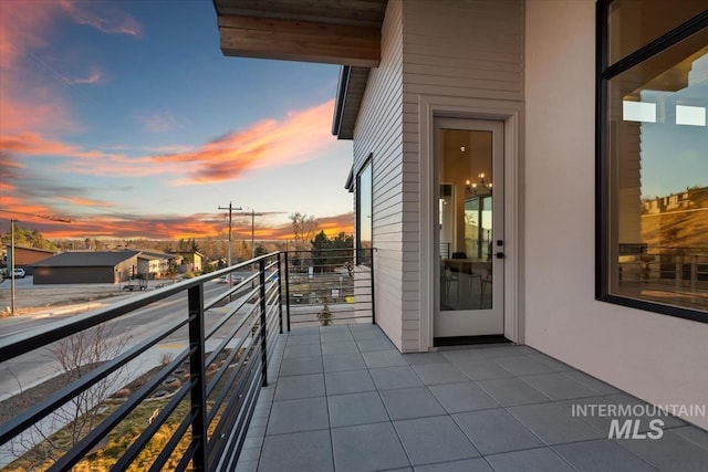 view of balcony at dusk