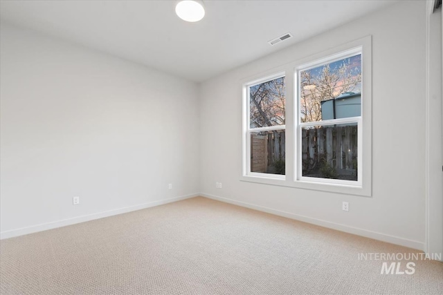 unfurnished room featuring carpet floors