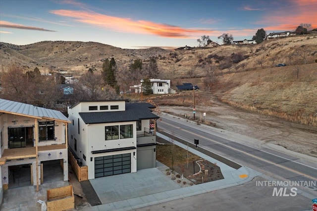 view of front of house with a mountain view and a garage