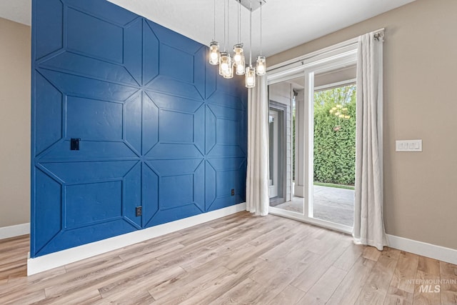 1073 W Smoky Quartz St, Kuna, ID 83634 - unfurnished room featuring baseboards and wood finished floors