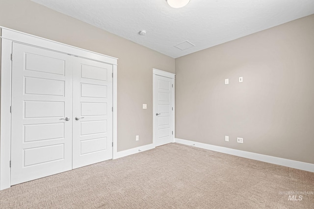 1073 W Smoky Quartz St, Kuna, ID 83634 - unfurnished bedroom featuring carpet, baseboards, a closet, and a textured ceiling