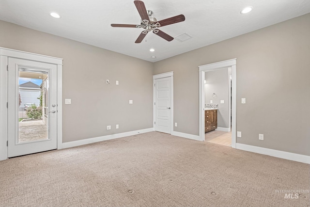 1073 W Smoky Quartz St, Kuna, ID 83634 - unfurnished bedroom featuring access to exterior, light carpet, ensuite bath, baseboards, and recessed lighting