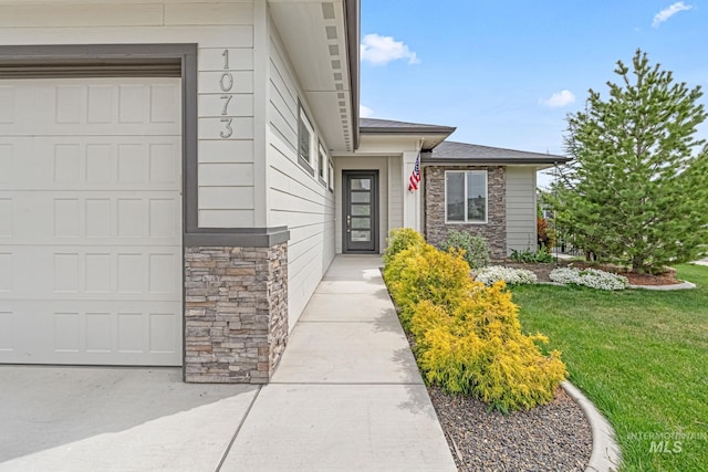 1073 W Smoky Quartz St, Kuna, ID 83634 - property entrance featuring stone siding and a lawn