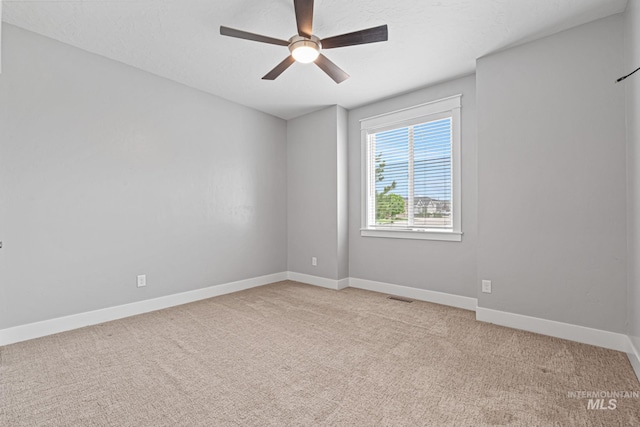 1073 W Smoky Quartz St, Kuna, ID 83634 - carpeted spare room featuring a ceiling fan and baseboards