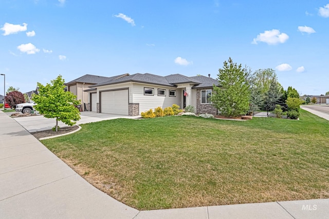 1073 W Smoky Quartz St, Kuna, ID 83634 - prairie-style home with a garage, driveway, a front lawn, and stone siding