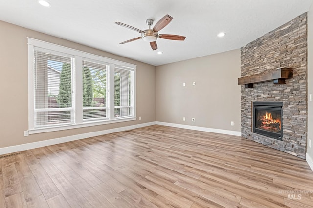 1073 W Smoky Quartz St, Kuna, ID 83634 - unfurnished living room with light wood finished floors, a ceiling fan, baseboards, and recessed lighting