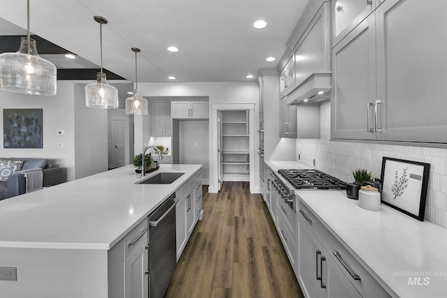 6251 S Utmost Ln, Meridian, ID 83642 - kitchen with appliances with stainless steel finishes, dark wood-style flooring, recessed lighting, gray cabinets, and backsplash