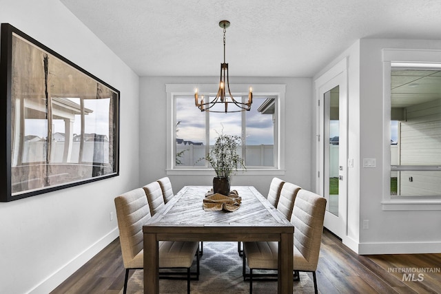 6251 S Utmost Ln, Meridian, ID 83642 - dining area with a chandelier, dark wood-type flooring, and a textured ceiling