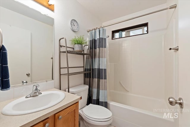 full bathroom with vanity, toilet, and shower / bath combo with shower curtain